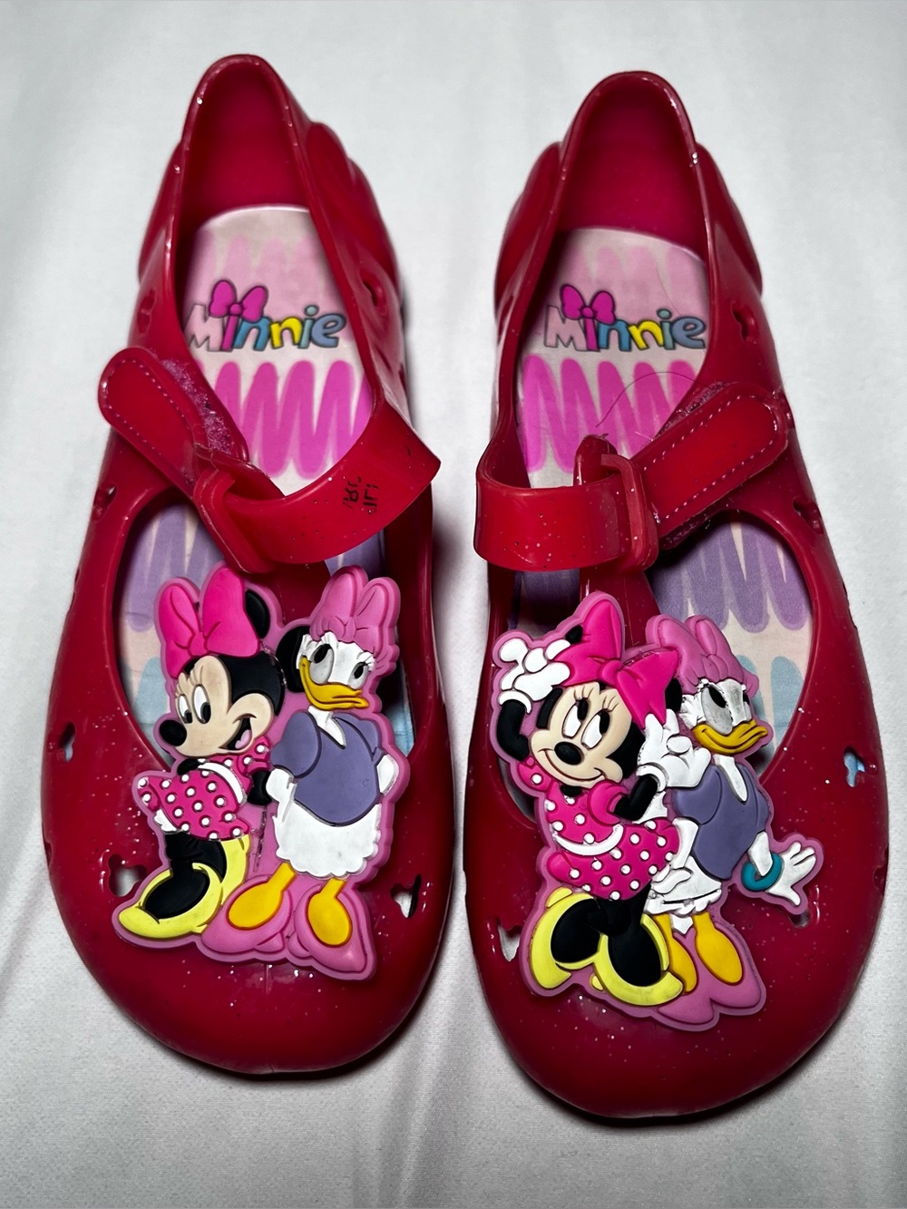 Disney pink glitter jelly shoes featuring 3D Minnie Mouse and Daisy Duck size 10